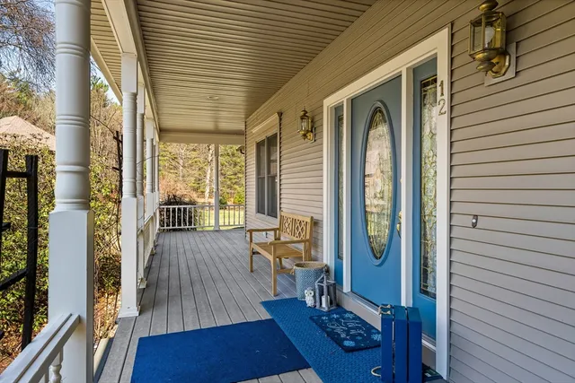 a view of a balcony with wooden floor