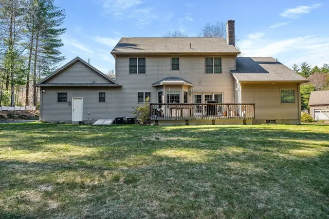 a view of a house with backyard and porch