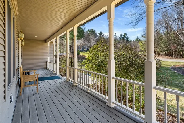 a view of a balcony with wooden floor