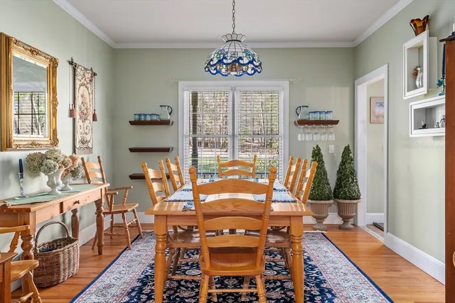 a very nice looking dining room with furniture window and outside view