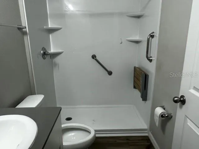 a bathroom with a toilet and a tub