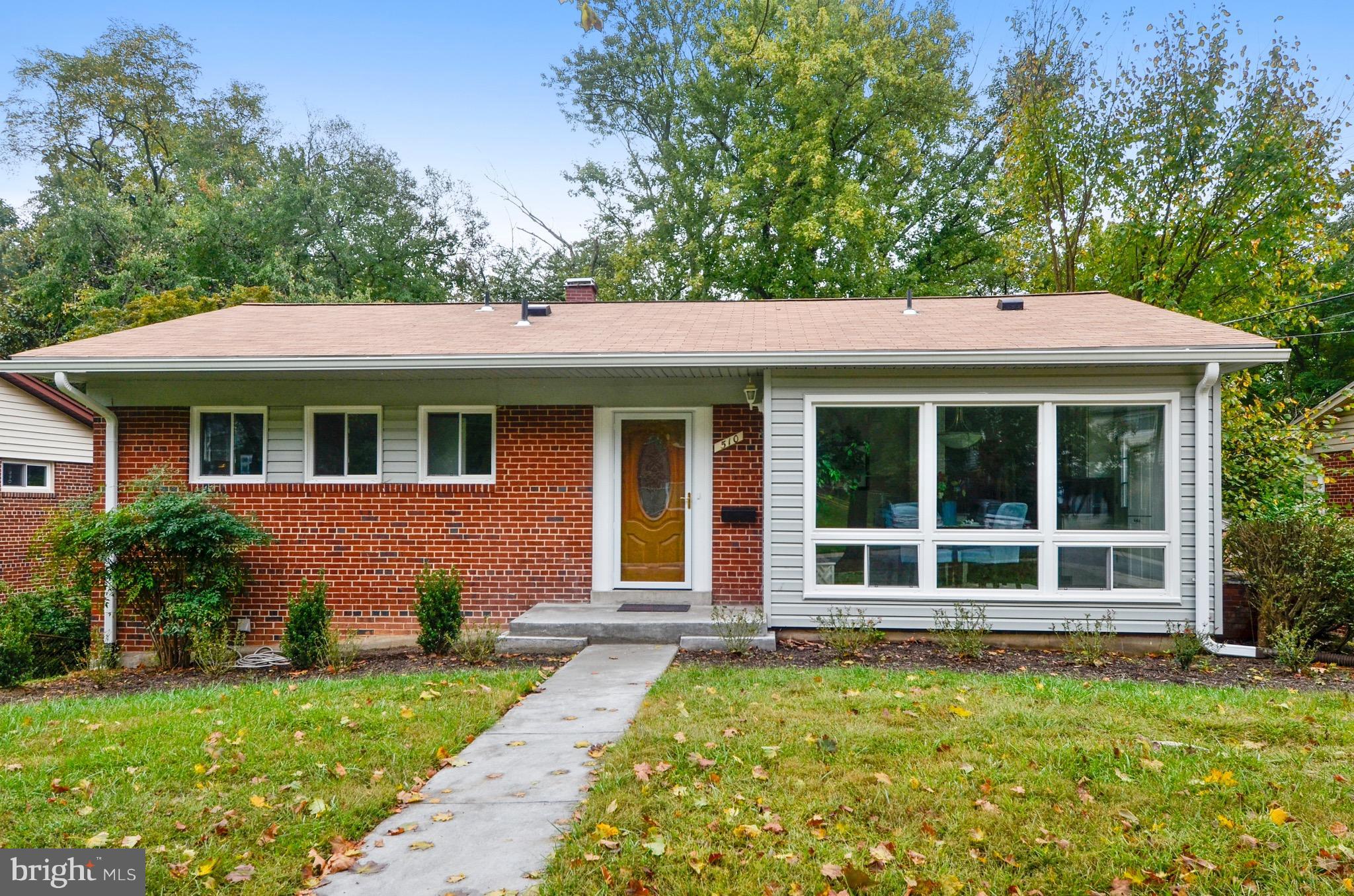 510 Waterford Road Silver Spring, MD 20901 - Photo 1 of 30 a front view of a house with a garden