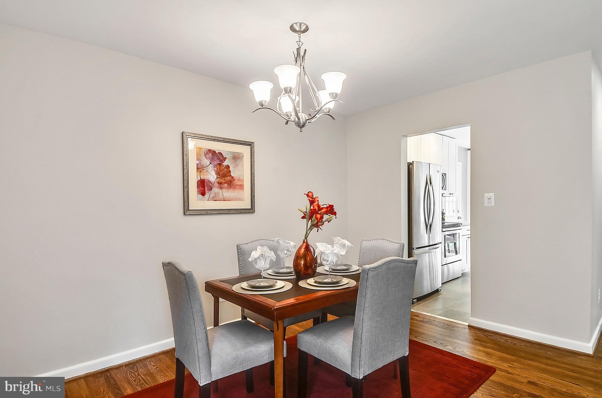 510 Waterford Road Silver Spring, MD 20901 - Photo 11 of 30 a view of a dining room with furniture and wooden floor
