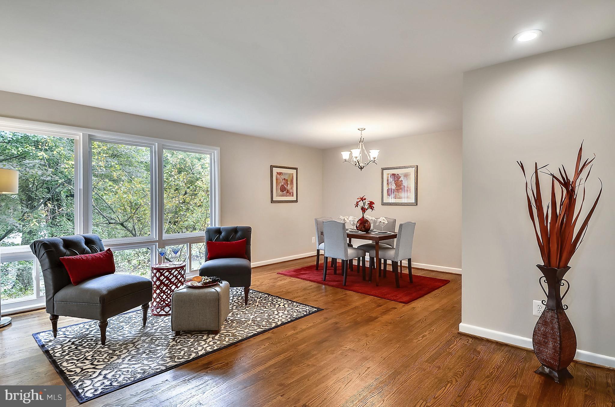 510 Waterford Road Silver Spring, MD 20901 - Photo 12 of 30 a living room with furniture a table and a large window