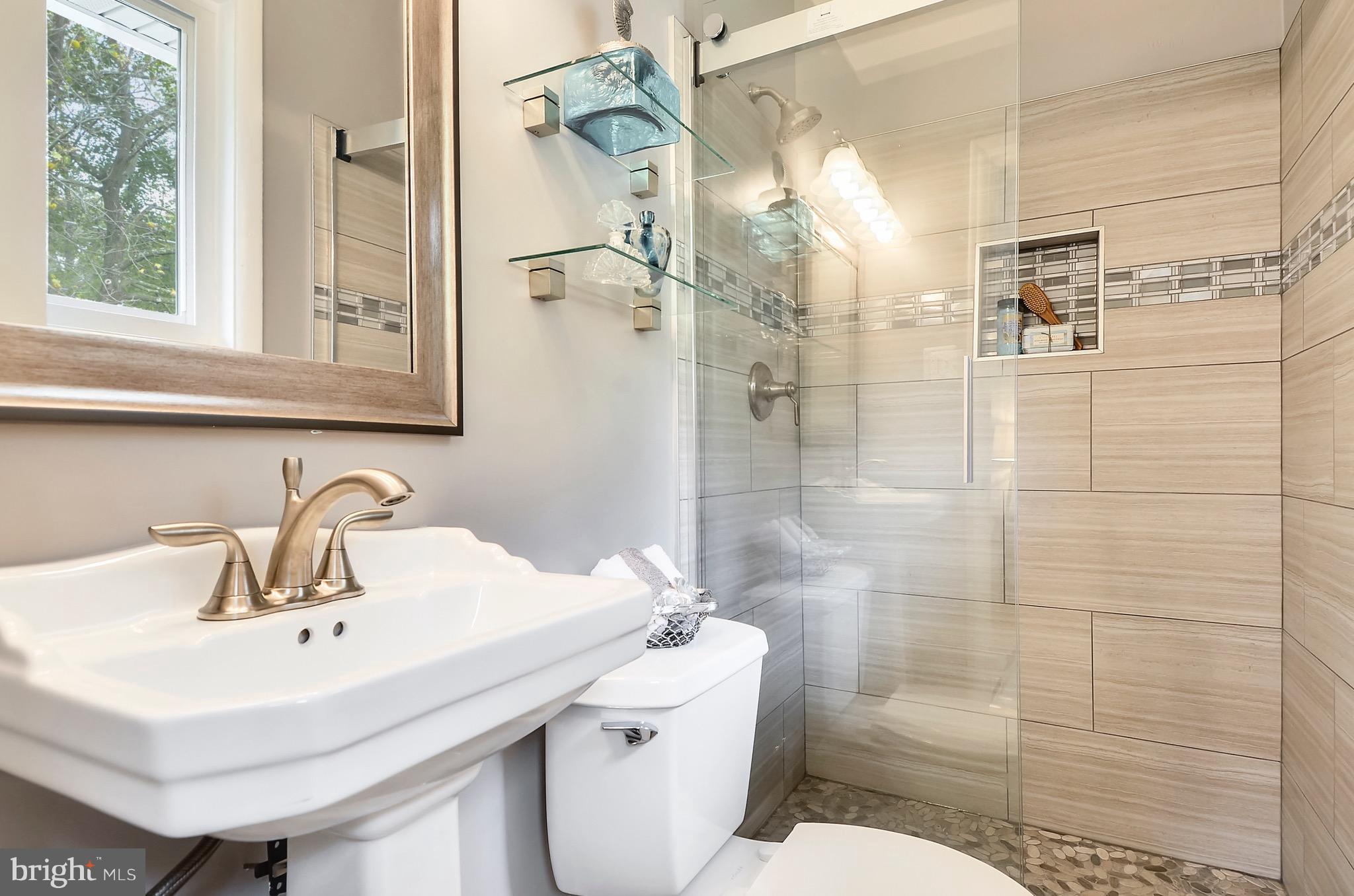 510 Waterford Road Silver Spring, MD 20901 - Photo 17 of 30 a bathroom with a sink toilet and shower