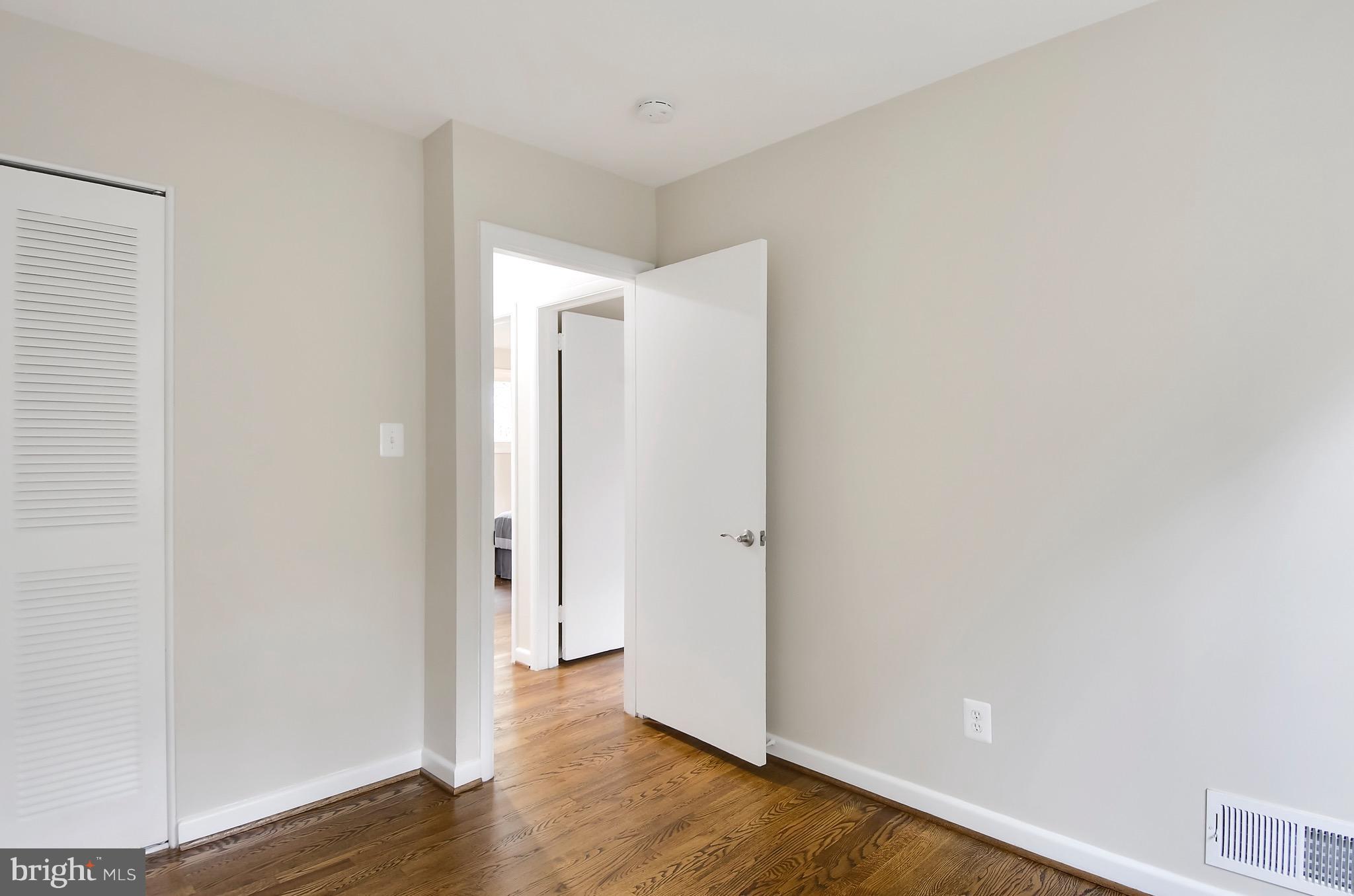 510 Waterford Road Silver Spring, MD 20901 - Photo 20 of 30 a view of an empty room with wooden floor