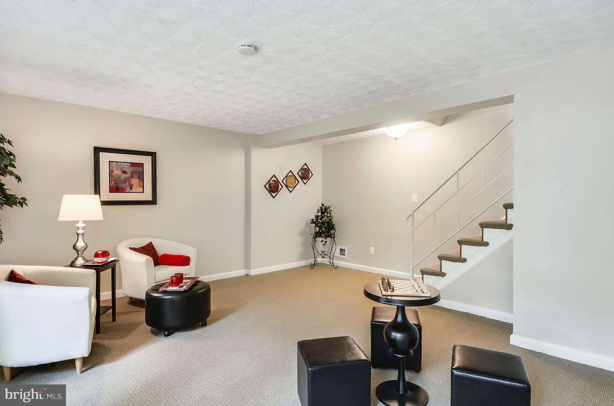 510 Waterford Road Silver Spring, MD 20901 - Photo 21 of 30 a living room with furniture and stairs