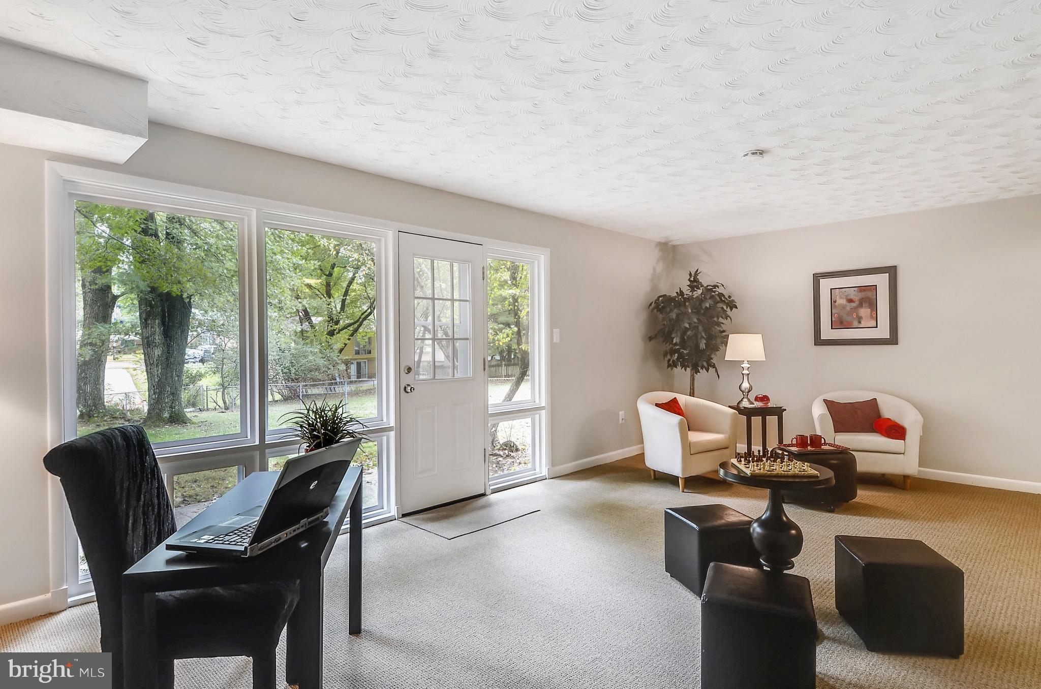 510 Waterford Road Silver Spring, MD 20901 - Photo 22 of 30 a living room with furniture and a large window