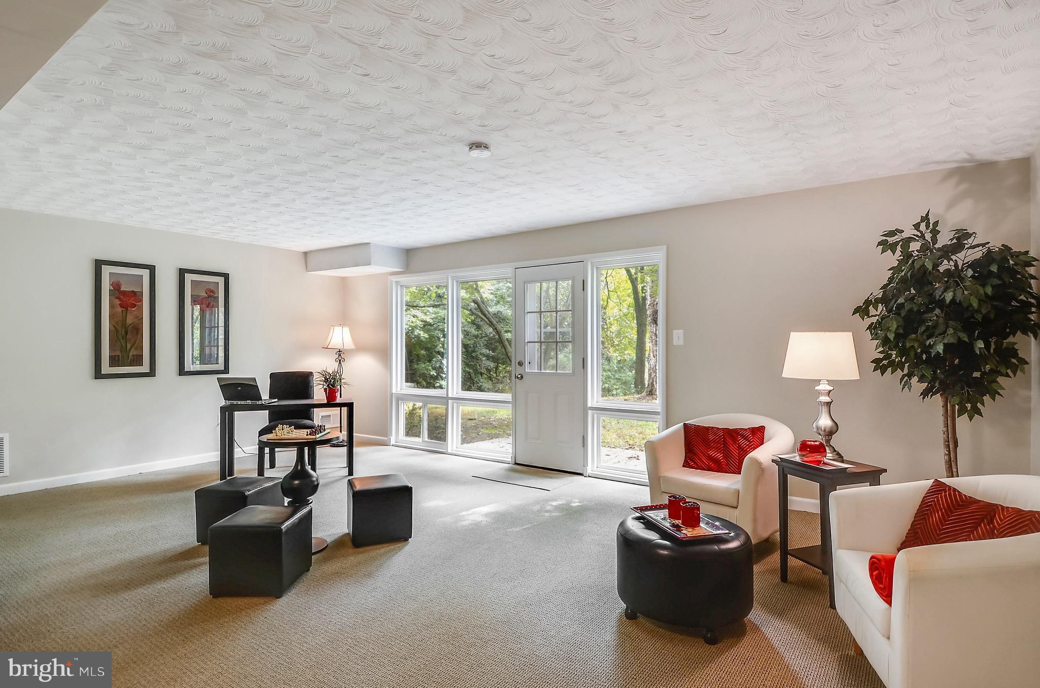 510 Waterford Road Silver Spring, MD 20901 - Photo 23 of 30 a living room with furniture and a large window