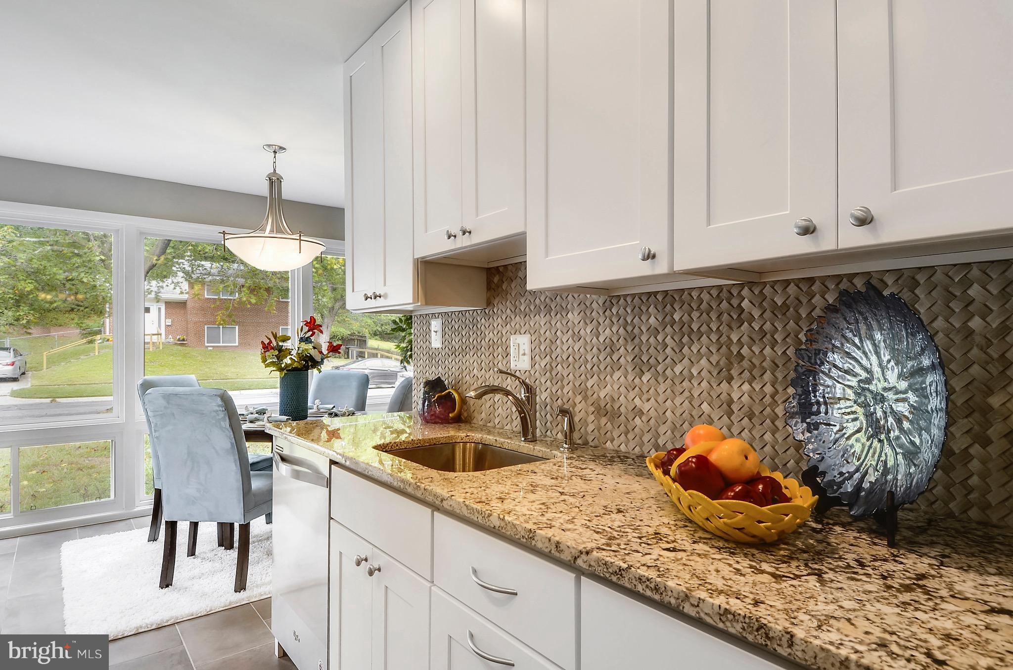 510 Waterford Road Silver Spring, MD 20901 - Photo 4 of 30 a kitchen with white cabinets and sink