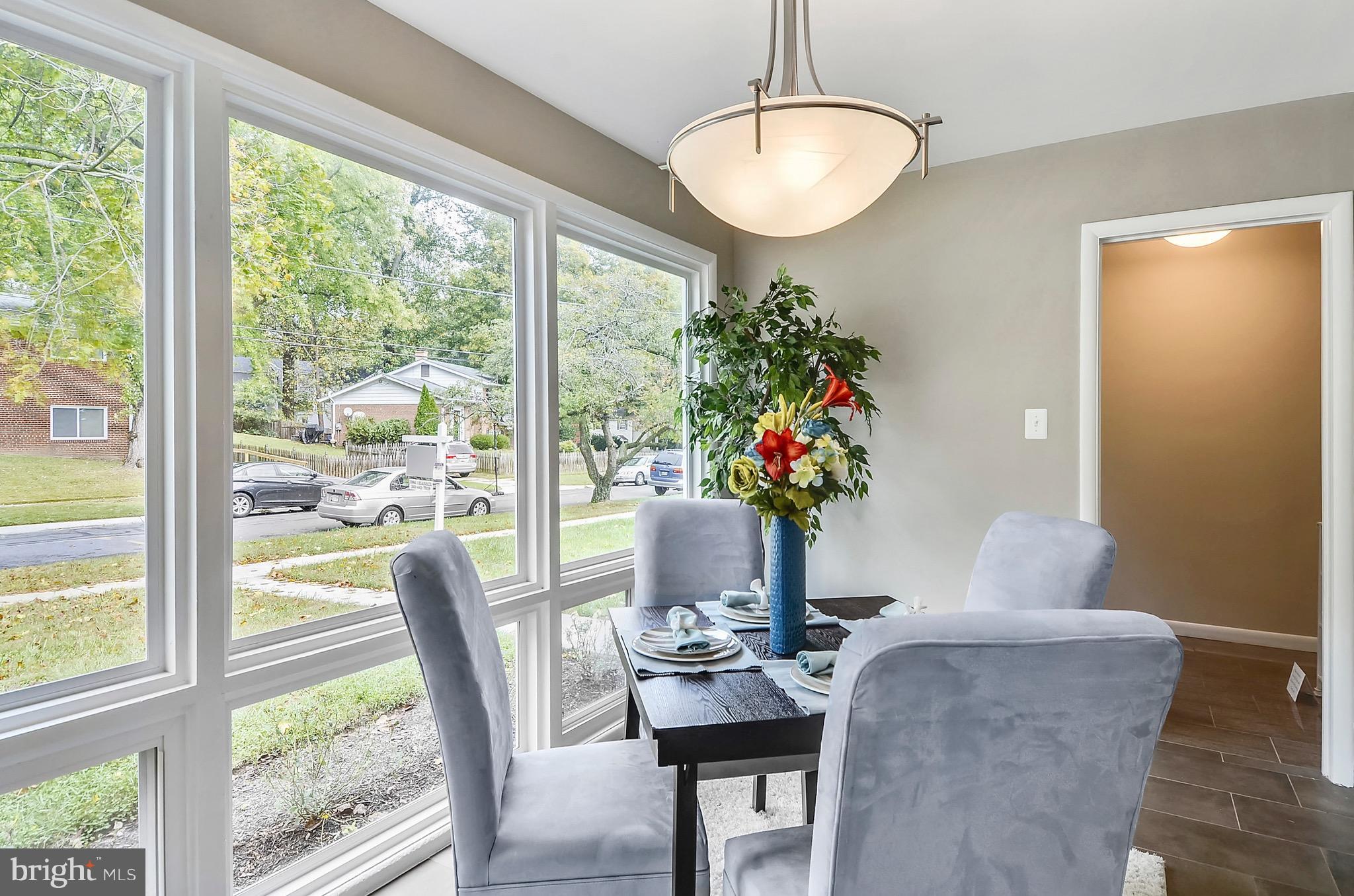 510 Waterford Road Silver Spring, MD 20901 - Photo 5 of 30 a view of a dining room with furniture window and wooden floor
