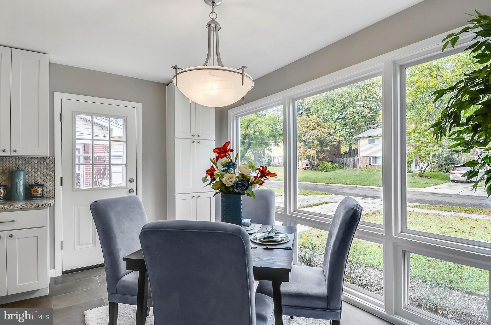 510 Waterford Road Silver Spring, MD 20901 - Photo 6 of 30 a view of a dining room with furniture window and outside view