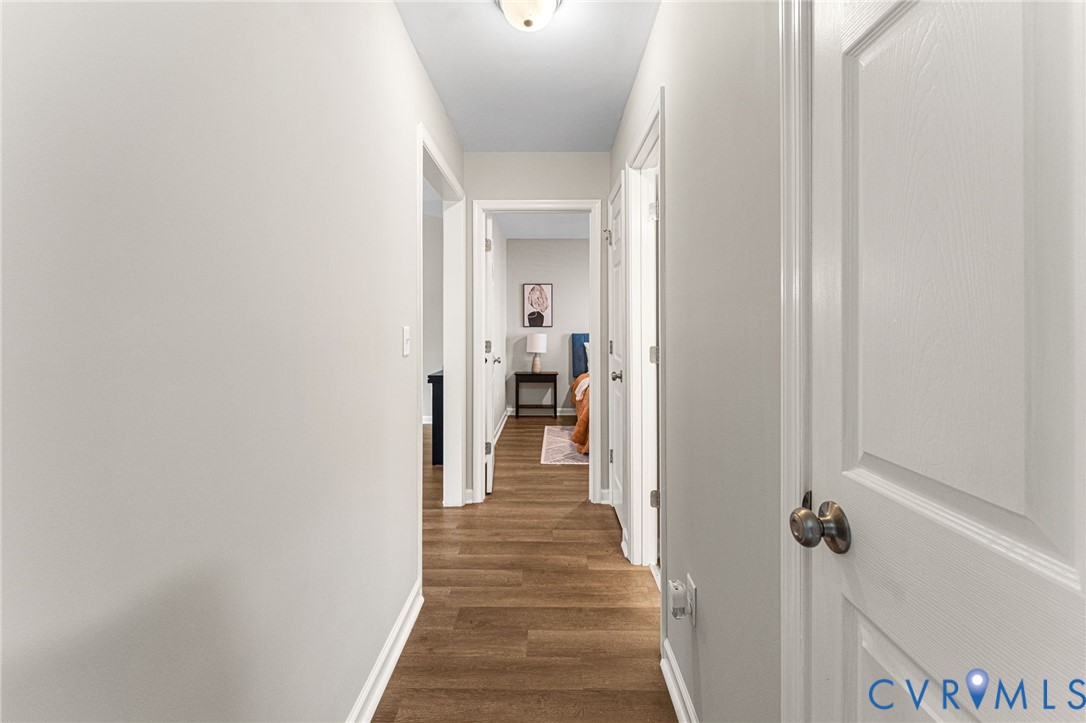 829 Rome Street Petersburg, VA 23803 - Photo 19 of 22 a view of a hallway with wooden floor and closet