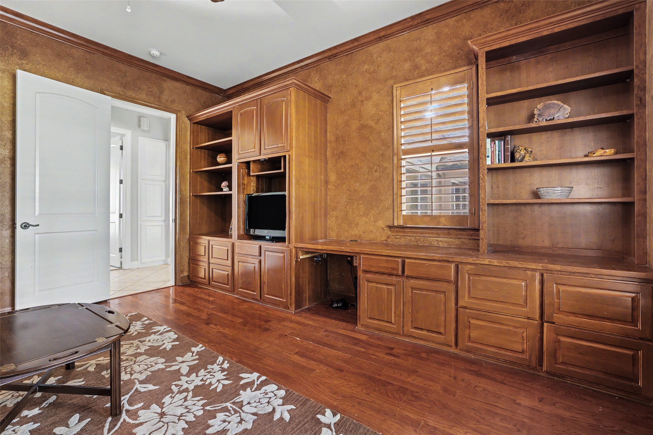 33 Meadows End Georgetown, TX 78628 - Photo 33 of 40 Custom built-in cabinetry and warm hardwood flooring define this inviting study.