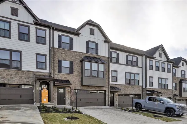 a car parked in front of a brick building