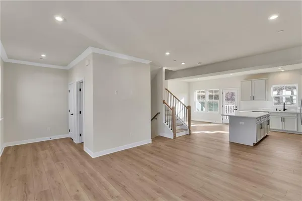 a view of kitchen with cabinets and wooden floor