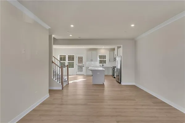 a view of a living room with wooden floor