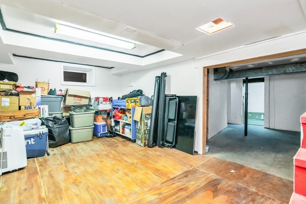 42 D Street Lowell, MA 01851 - Photo 5 of 27 a bed room with a bed and furniture