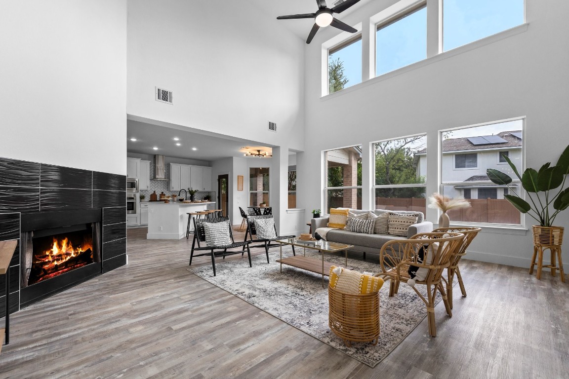 a living room with furniture and a fireplace