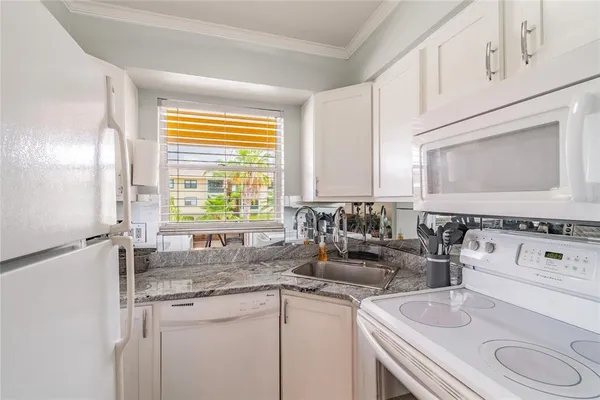 a close view of sink and mirror with window