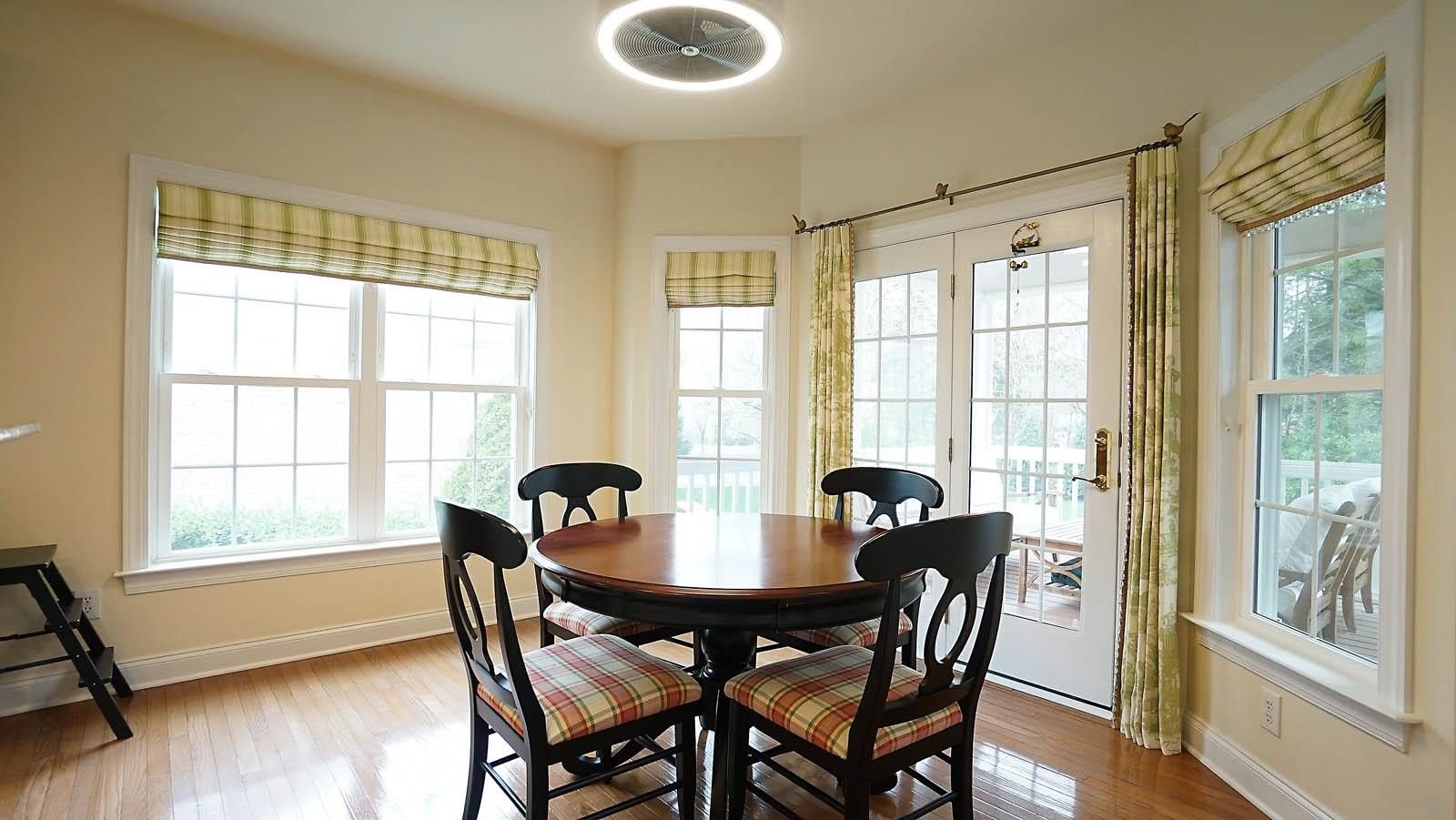 10217 Sporting Club Drive Raleigh, NC 27617 - Photo 9 of 45 Beautiful breakfast area with a unique fan light and access to the screened porch. Breakfast Area