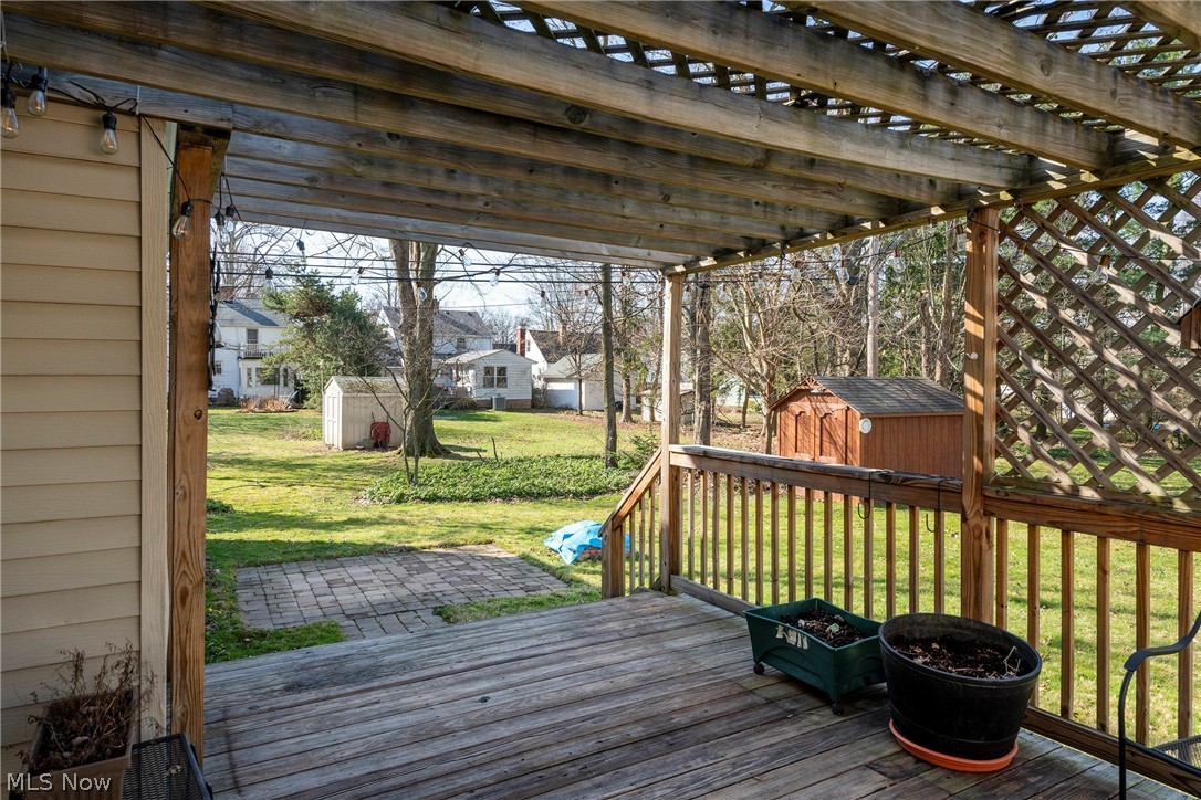 1170 Roland Road Lyndhurst, OH 44124 - Photo 33 of 36 Deck with a pergola, a storage unit, and a yard
