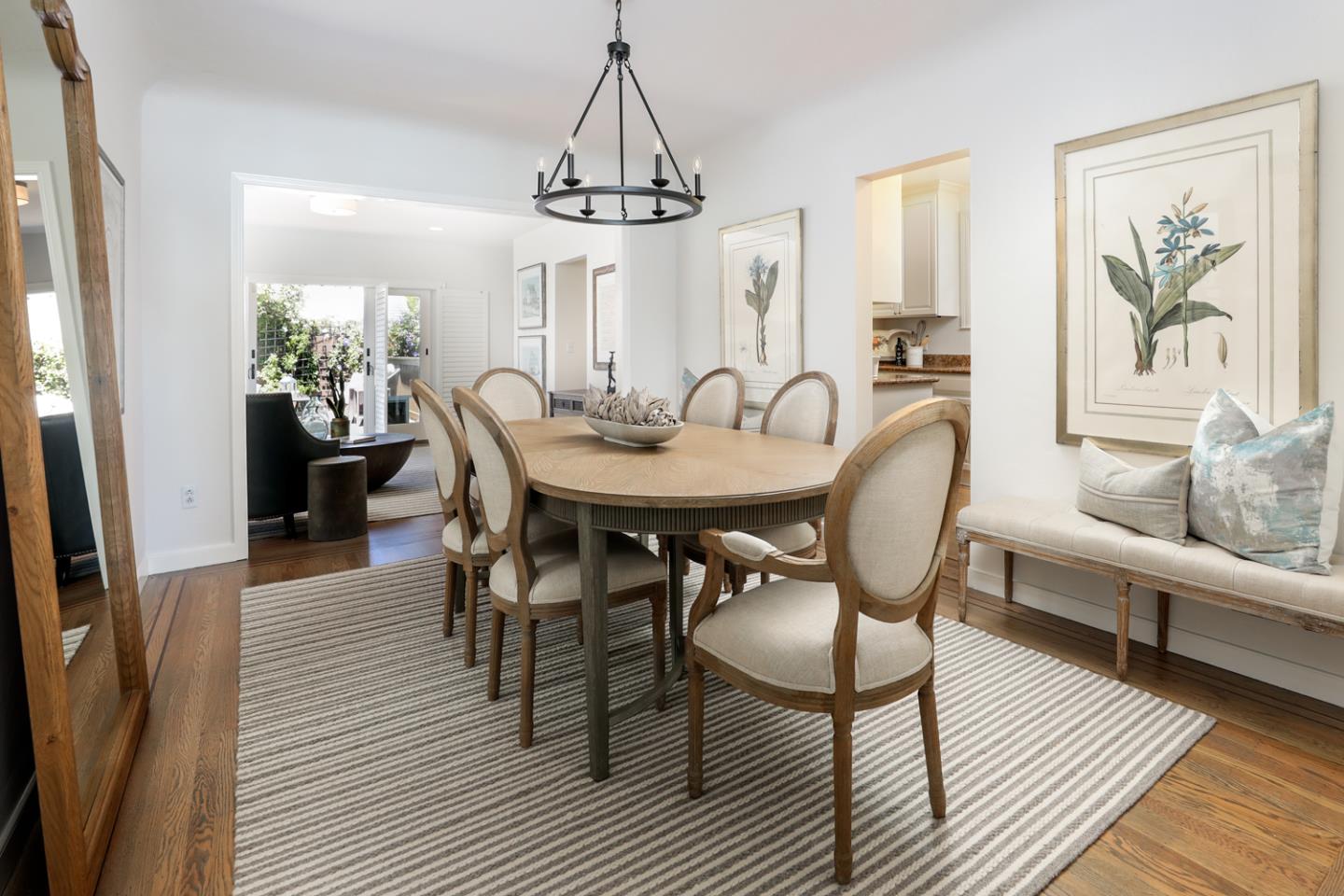 1104 Cambridge Road Burlingame, CA 94010 - Photo 14 of 34 a view of a dining room with furniture a rug and wooden floor