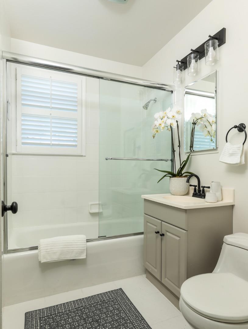 1104 Cambridge Road Burlingame, CA 94010 - Photo 21 of 34 a bathroom with a sink a toilet and shower