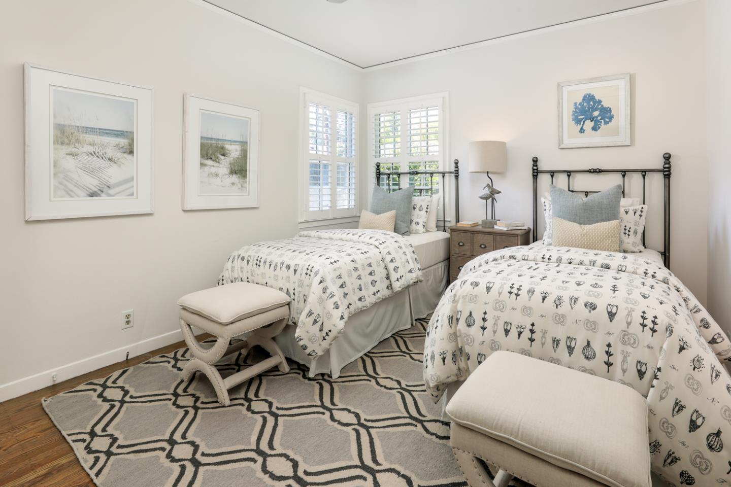 1104 Cambridge Road Burlingame, CA 94010 - Photo 23 of 34 a bedroom with a bed and wooden floor
