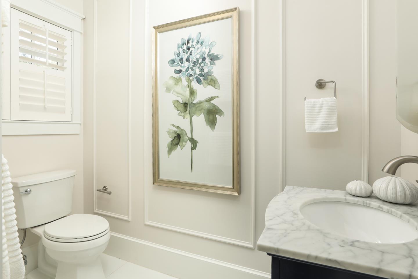 1104 Cambridge Road Burlingame, CA 94010 - Photo 24 of 34 a bathroom with a granite countertop sink a toilet and a shower