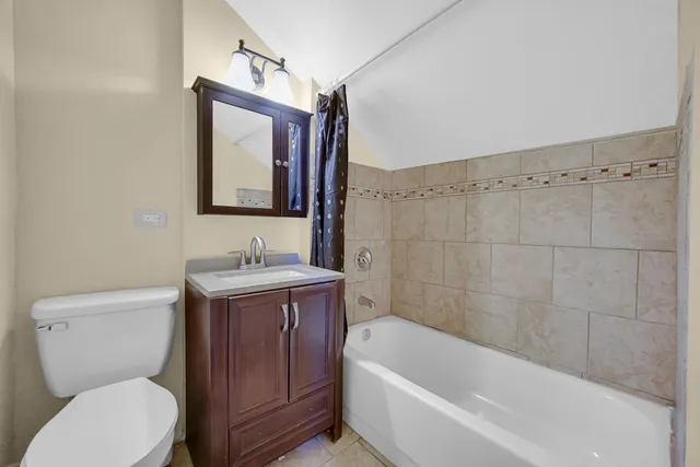 a bathroom with a sink a toilet and bathtub