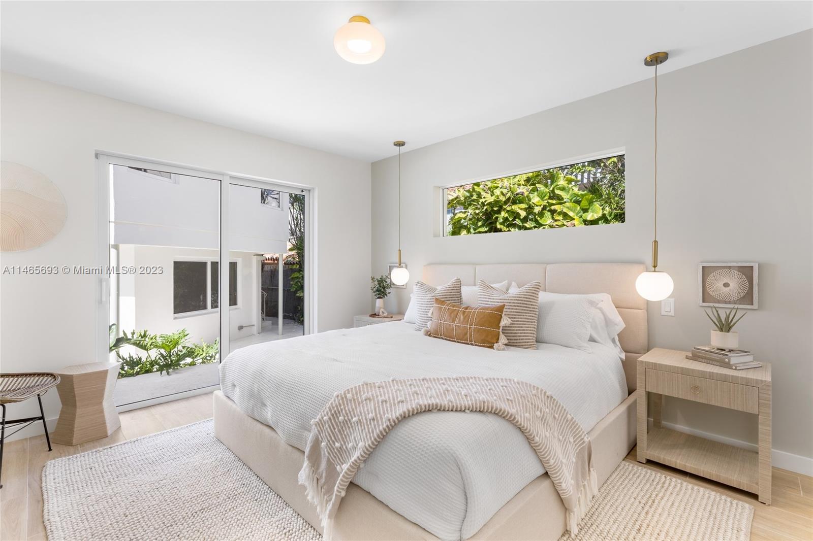 4160 Alton Road Miami Beach, FL 33140 - Photo 13 of 34 a bedroom with a bed and a couch