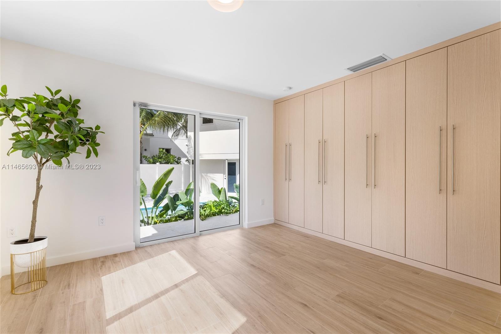 4160 Alton Road Miami Beach, FL 33140 - Photo 20 of 34 a view of entryway with wooden floor
