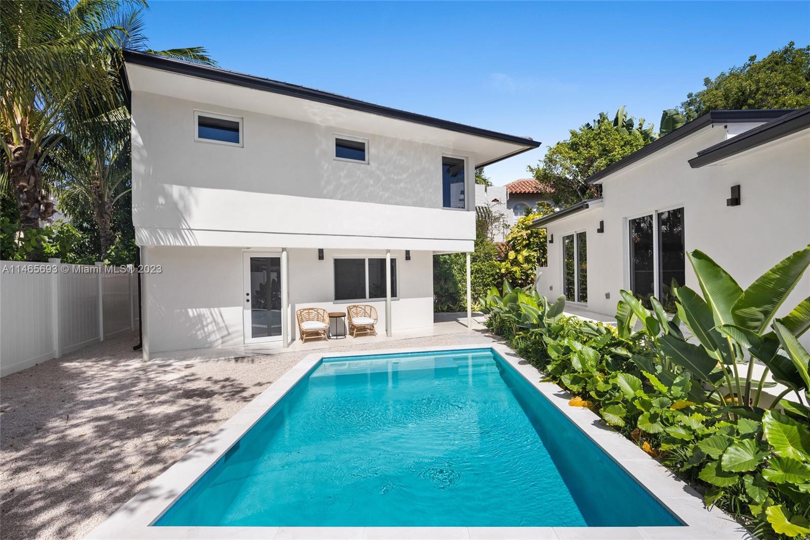 4160 Alton Road Miami Beach, FL 33140 - Photo 30 of 34 a front view of house with yard and outdoor seating
