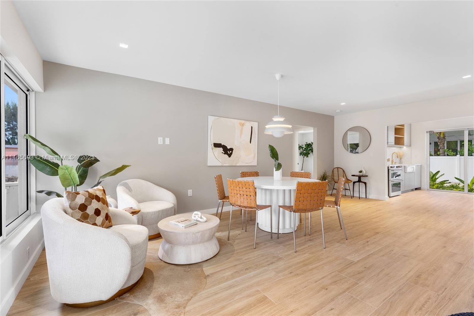 4160 Alton Road Miami Beach, FL 33140 - Photo 6 of 34 a living room with furniture and wooden floor