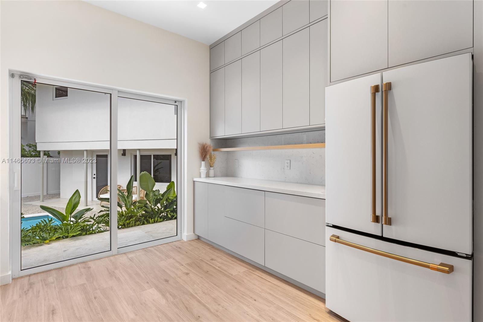 4160 Alton Road Miami Beach, FL 33140 - Photo 8 of 34 a view of kitchen with furniture and refrigerator