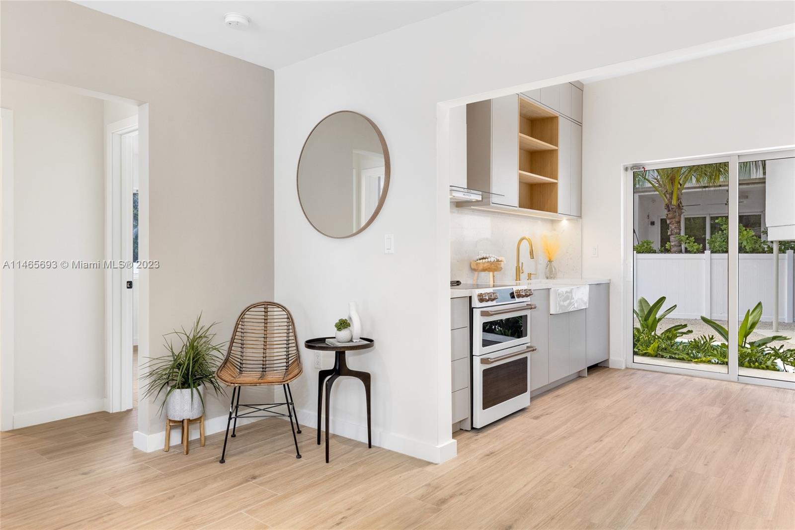 4160 Alton Road Miami Beach, FL 33140 - Photo 10 of 34 a view of a workspace with furniture and a potted plant