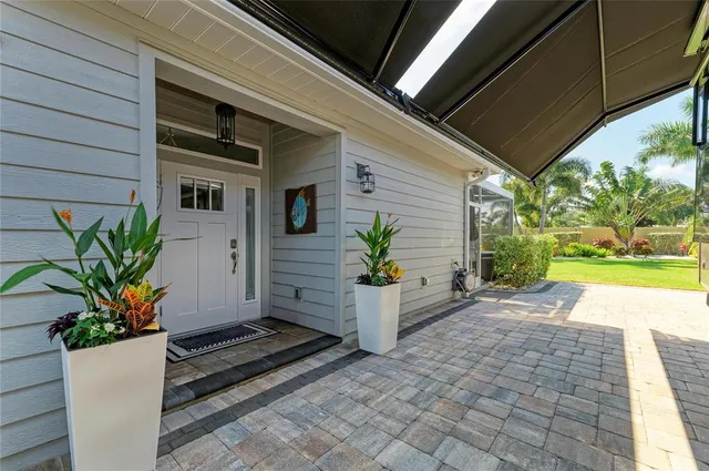 a large kitchen with kitchen island a large window in it