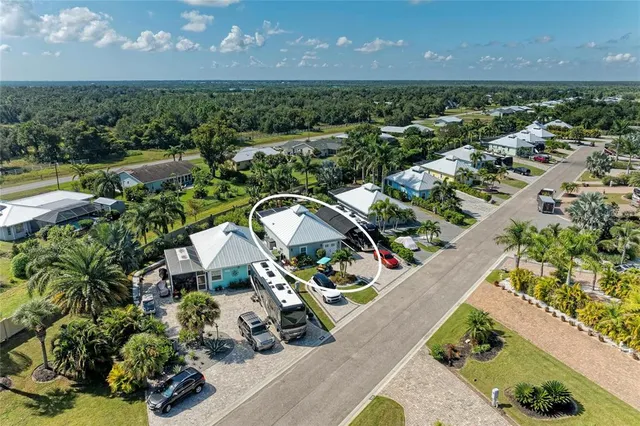 an aerial view of a house with a garden and swimming pool
