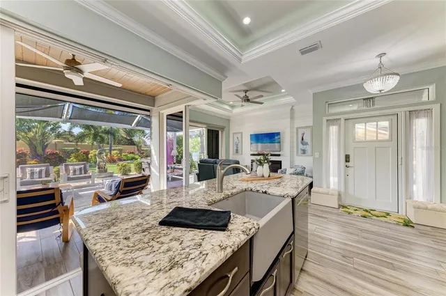 a large white kitchen with a large window