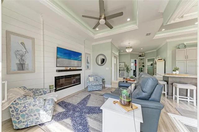 a kitchen with granite countertop a refrigerator sink and cabinets