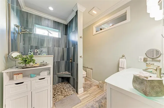 a view of a workspace with furniture and wooden floor