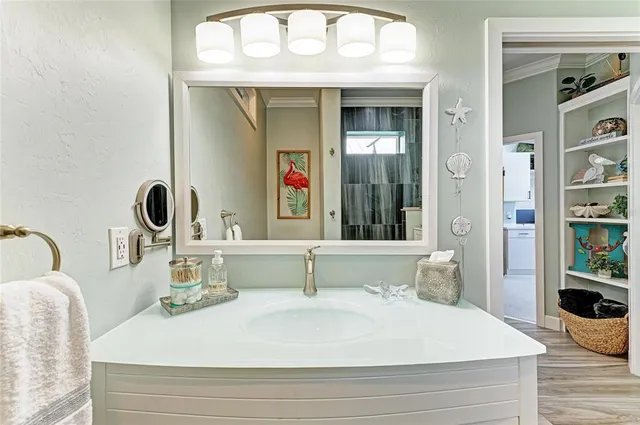 a view of a patio with table and chairs potted plants with wooden floor