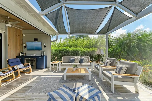 a view of an empty room with a window and a ceiling fan