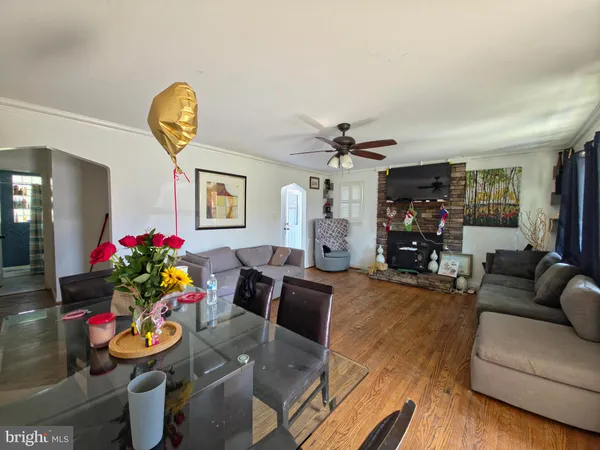 a living room with furniture and a lamp
