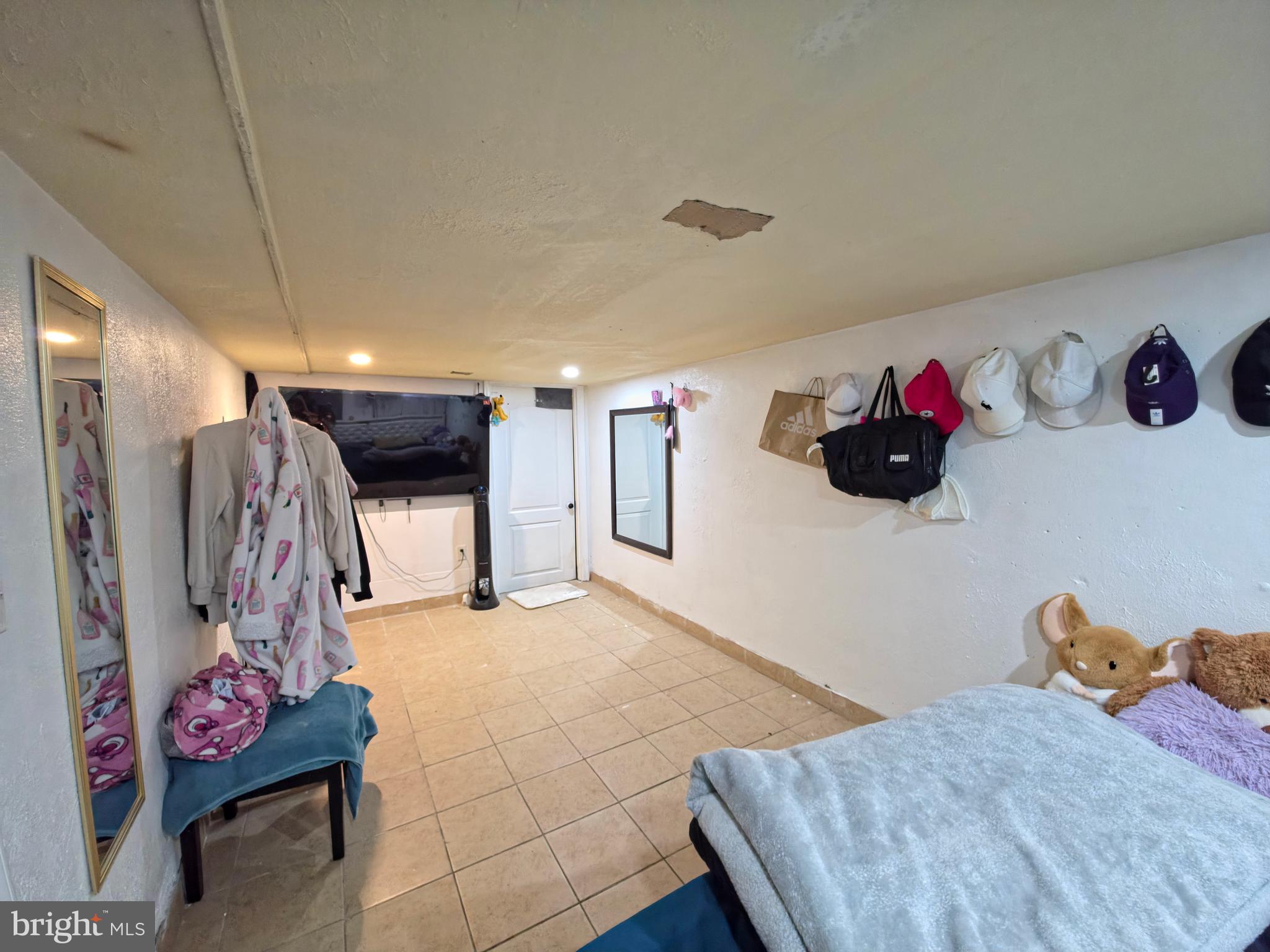 7450 Bensville Road Waldorf, MD 20603 - Photo 24 of 41 a bedroom with a bed and a flat screen tv