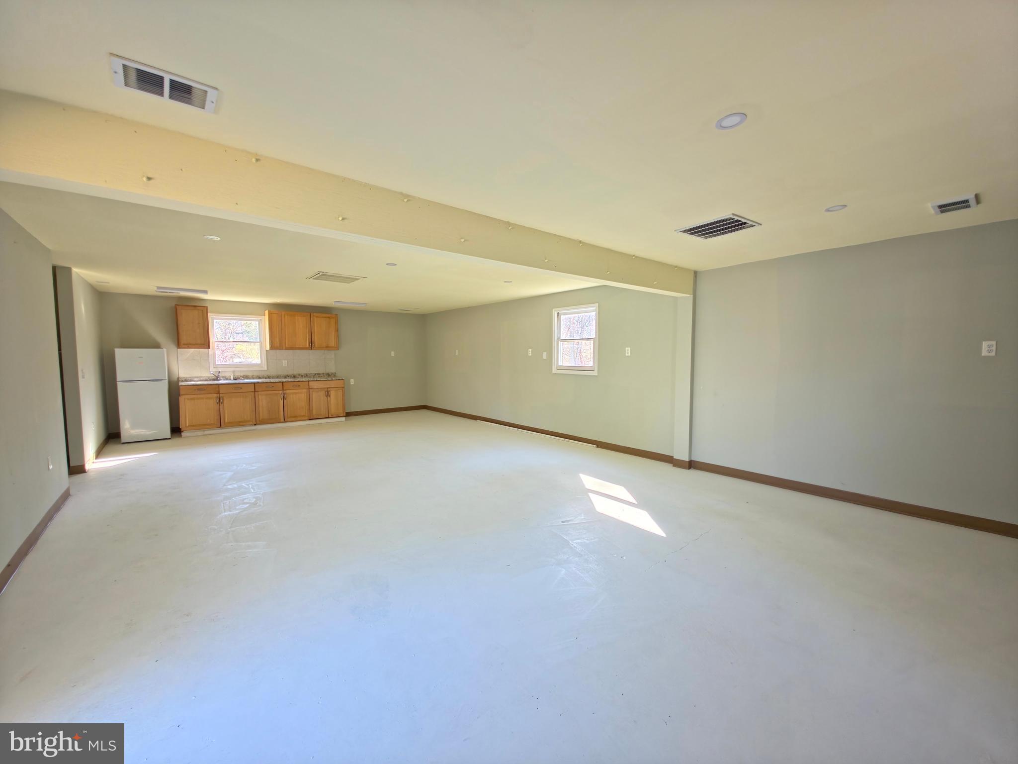 7450 Bensville Road Waldorf, MD 20603 - Photo 25 of 41 a view of an empty room with a kitchen