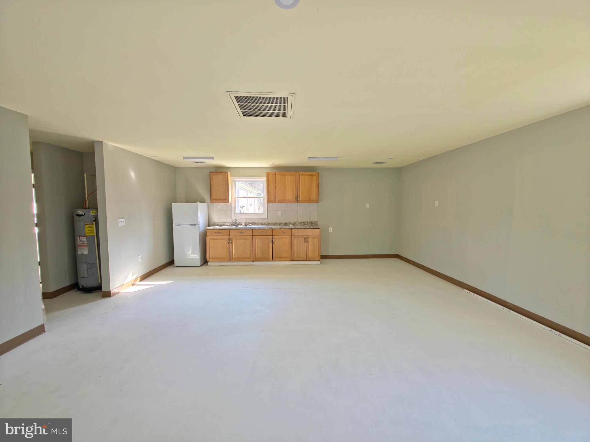 7450 Bensville Road Waldorf, MD 20603 - Photo 38 of 41 a view of empty room with a kitchen