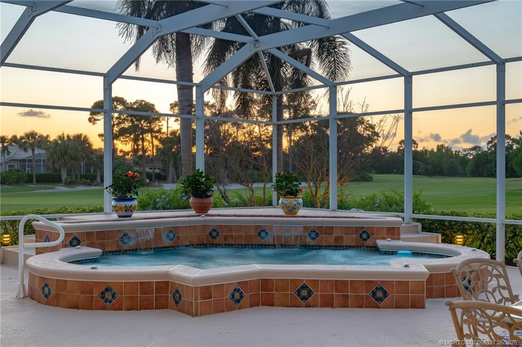 2216 Southeast Stonehaven Road Port St. Lucie, FL 34952 - Photo 43 of 67 a view of backyard with table and chairs