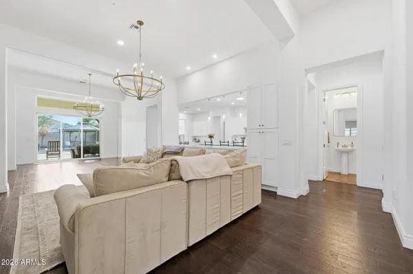 a kitchen with kitchen island a sink and a refrigerator